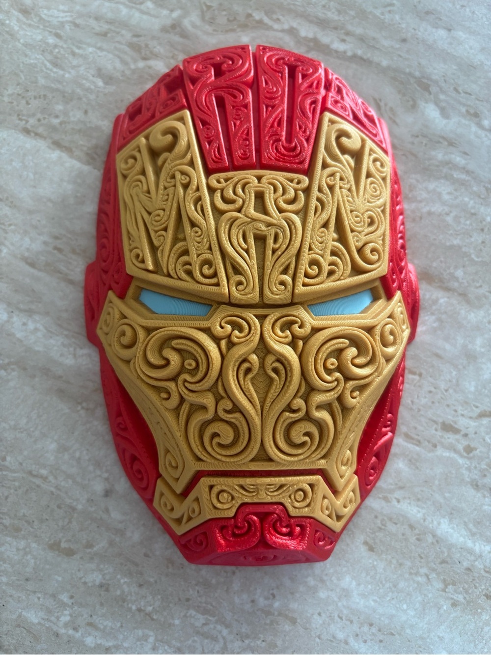 Intricate Gold and Red Stylized Helmet Wall Art